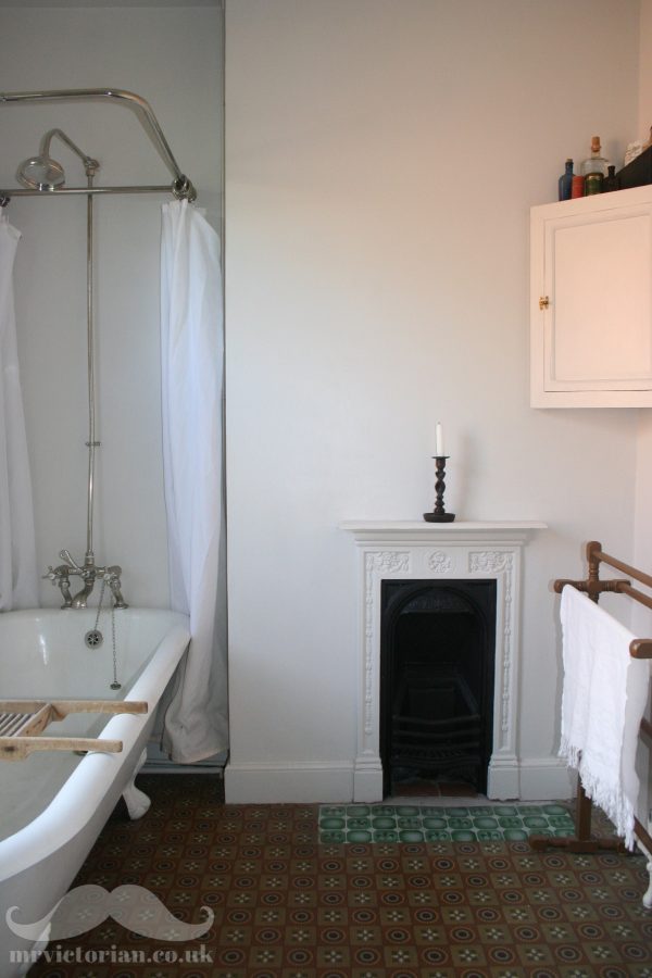Edwardian bathroom cast iron bath linoleum fireplace
