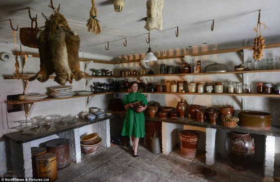 Victorian period organised pantry interior with old antique storage  stoneware jars