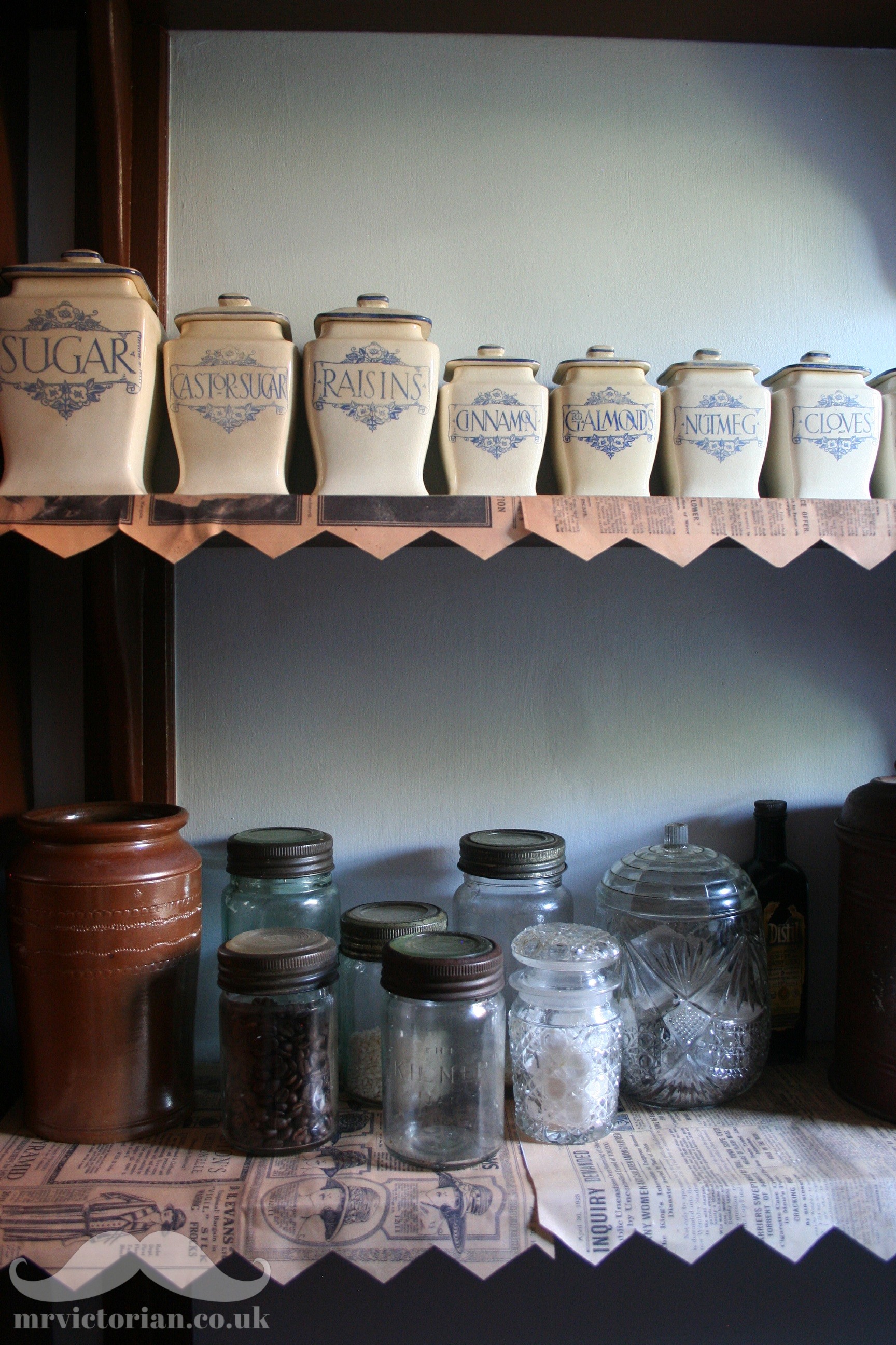 Victorian period organised pantry interior with old antique storage  stoneware jars