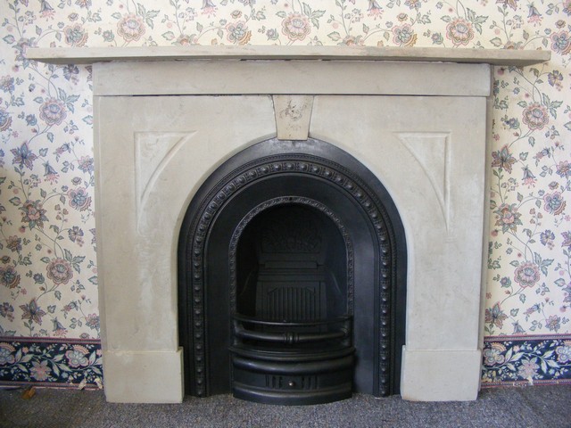 Victorian arched cast iron fireplace