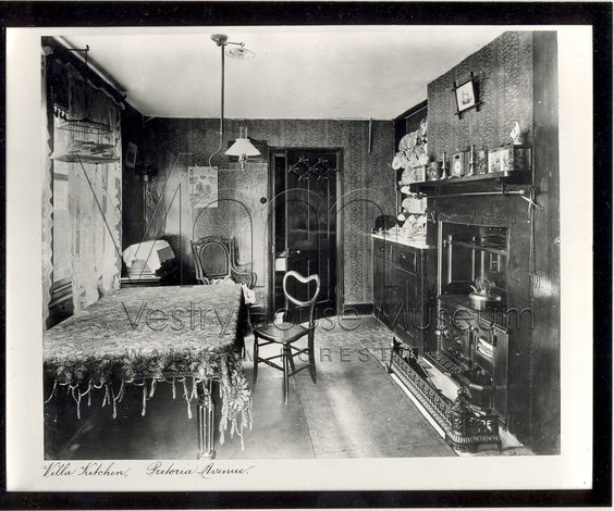 Victorian kitchen showing gas light lamp over table.