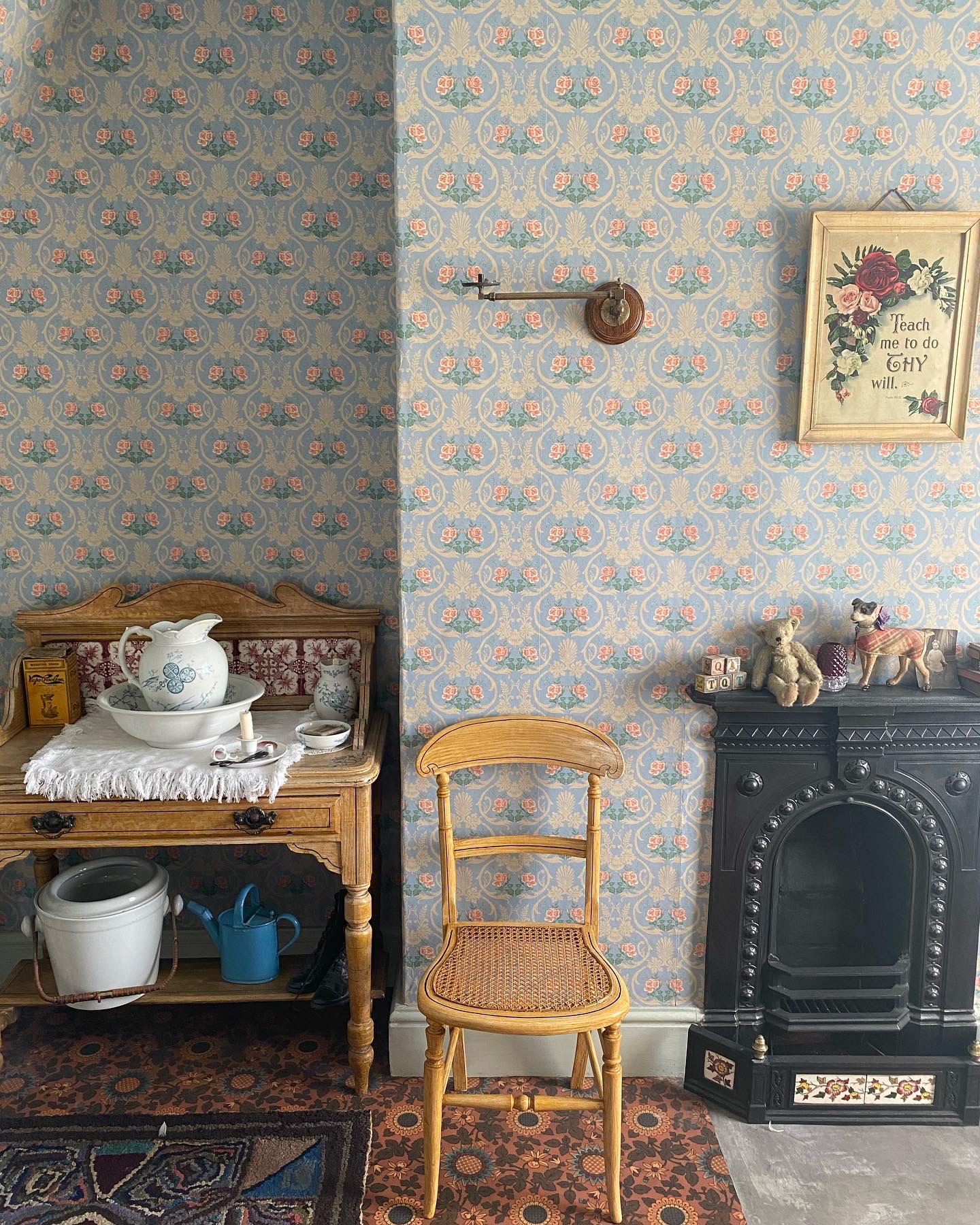 Victorian house tour - bedroom with fireplace and 1905 wallpaper, fireplace and washstand