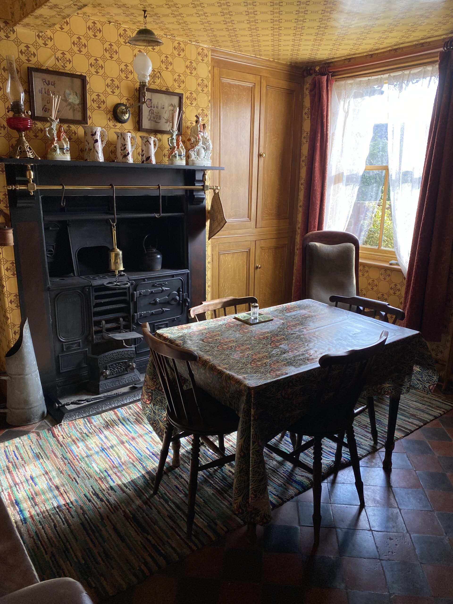 Victorian house tour - kitchen with cast iron range and 1895 sanitary wallpaper