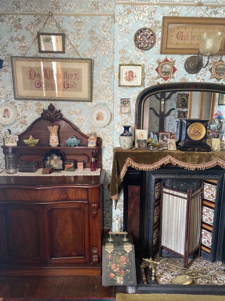 Victorian parlour with tiled fireplace and chiffonier