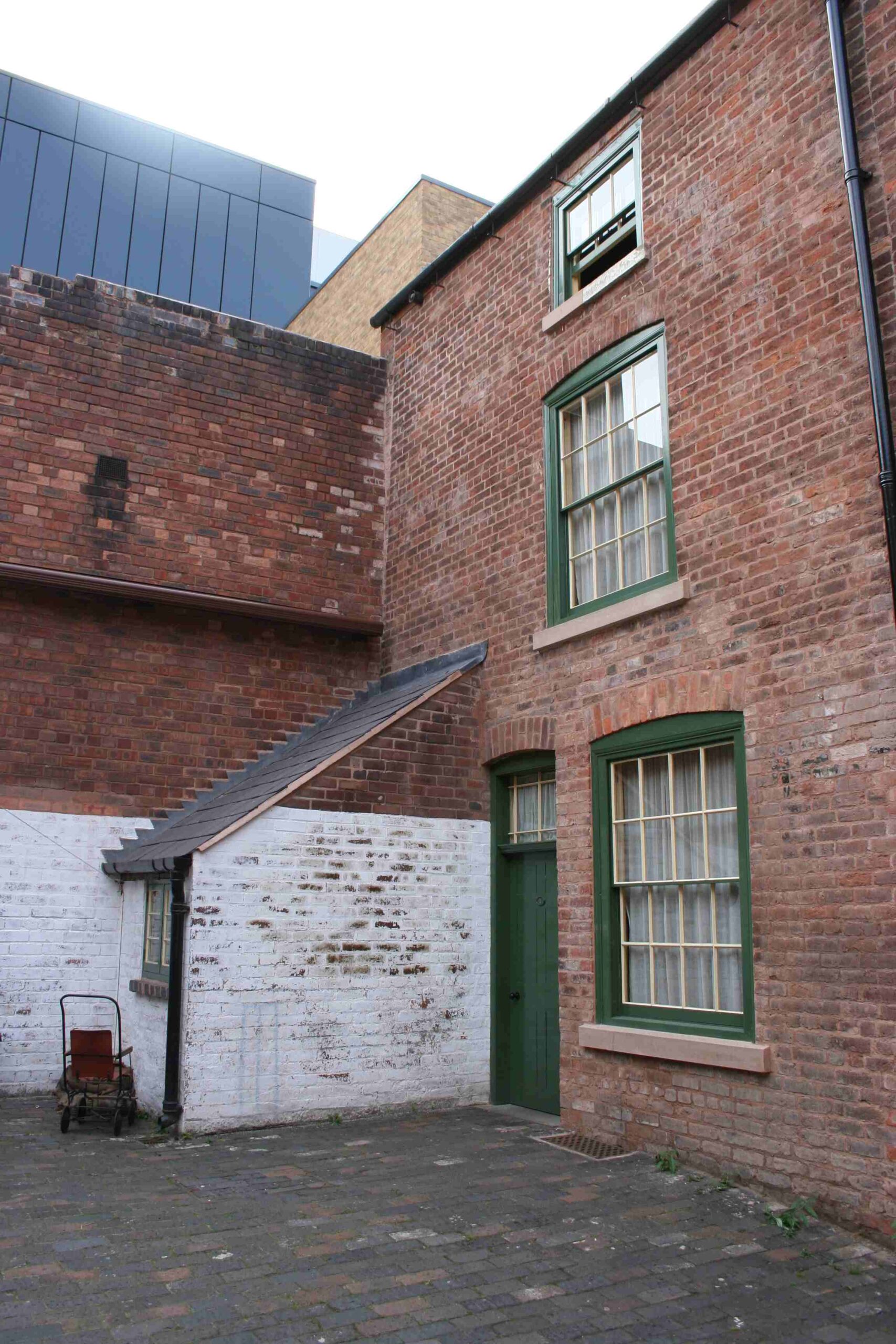 Victorian exterior paint example - two-tone windows at back-to-back houses in Birmingham run by the National Trust.