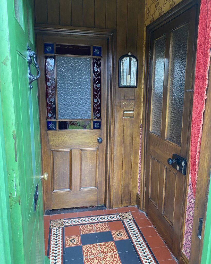 Victorian house tour - entrance hall with encaustic tile floor and etched glass door
