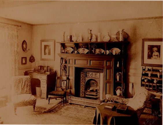 Victorian parlour interior showing Turkish rugs on what looks like a pale plain felt carpet surround.