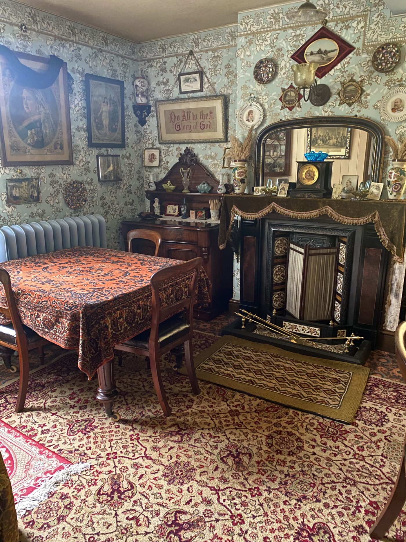 Victorian parlour showing a machine made Wilton carpet mimicking a Persian design