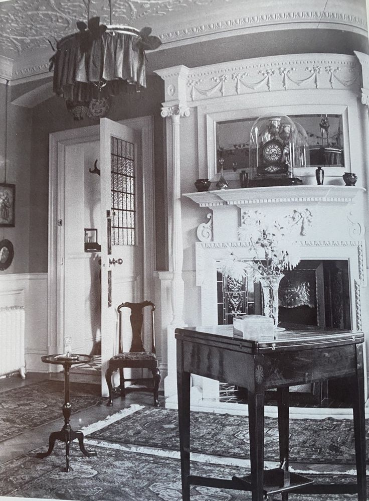 A fashionable and affluent Edwardian interior with handmade Persian rugs.