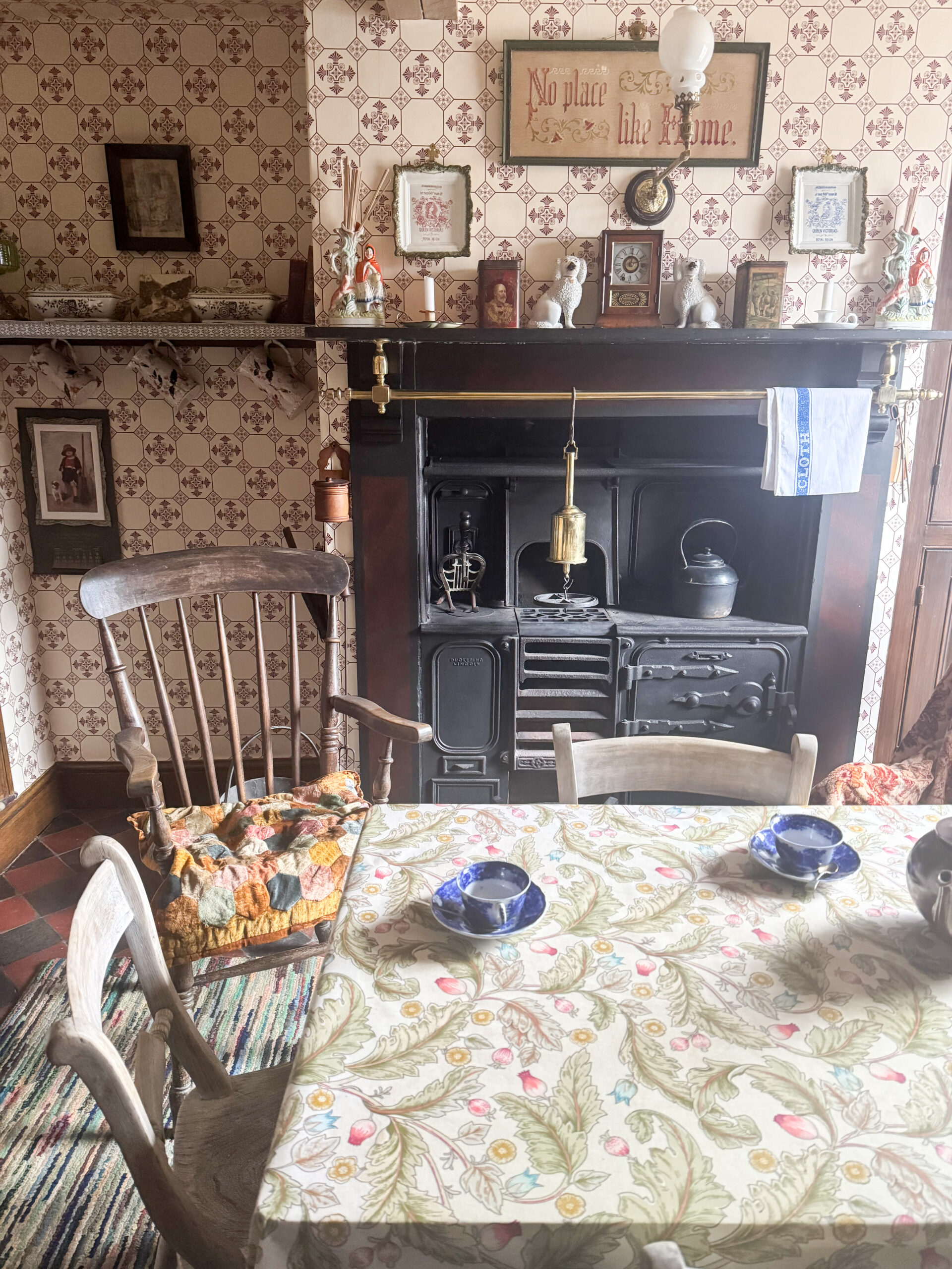 Victorian house tour - kitchen with cast iron range and 1895 sanitary wallpaper