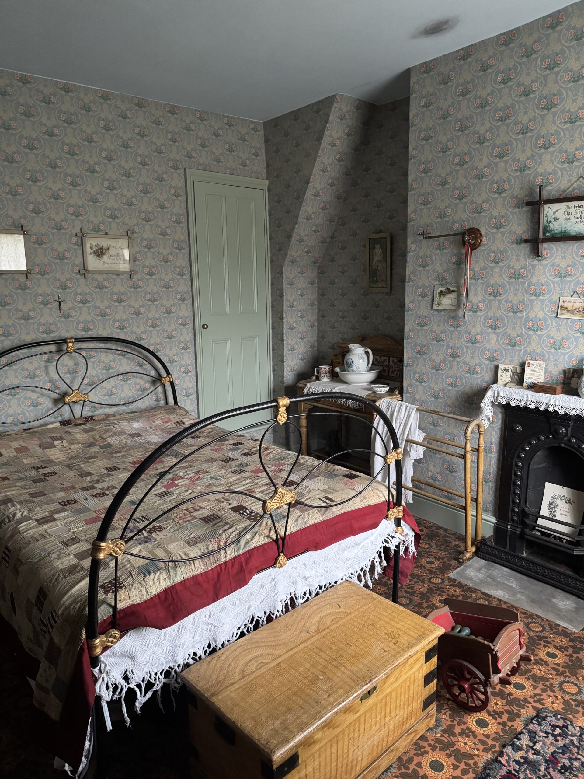 Victorian house tour - bedroom with reproduced 1905 wallpaper and fireplace